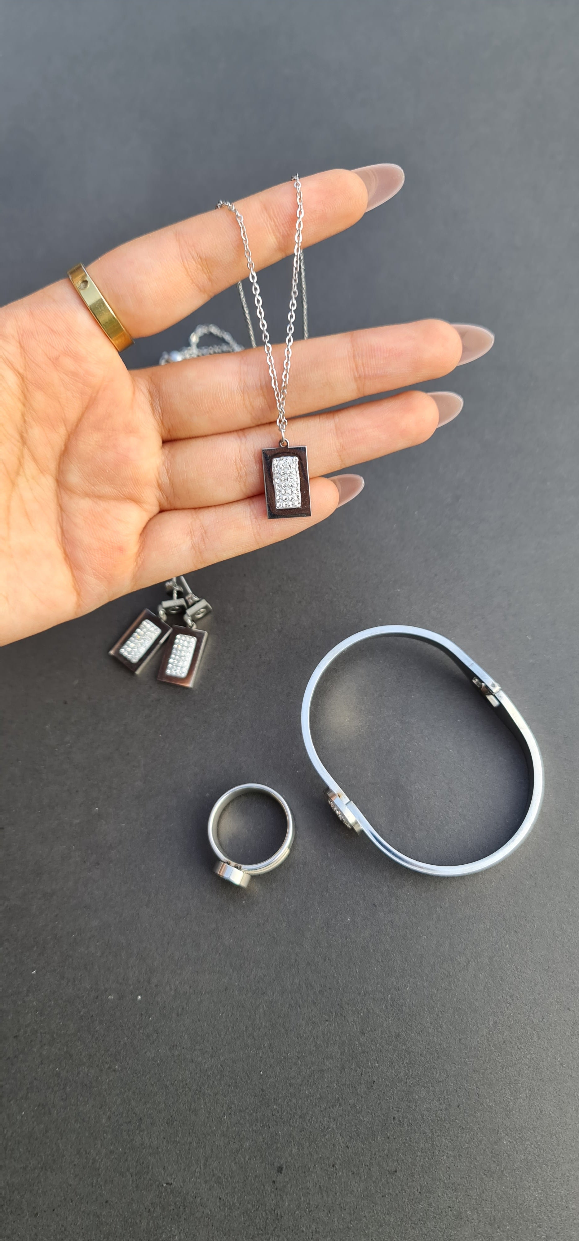 Stainless Steel Bracelet, Necklace, Ring, and Earring Set
