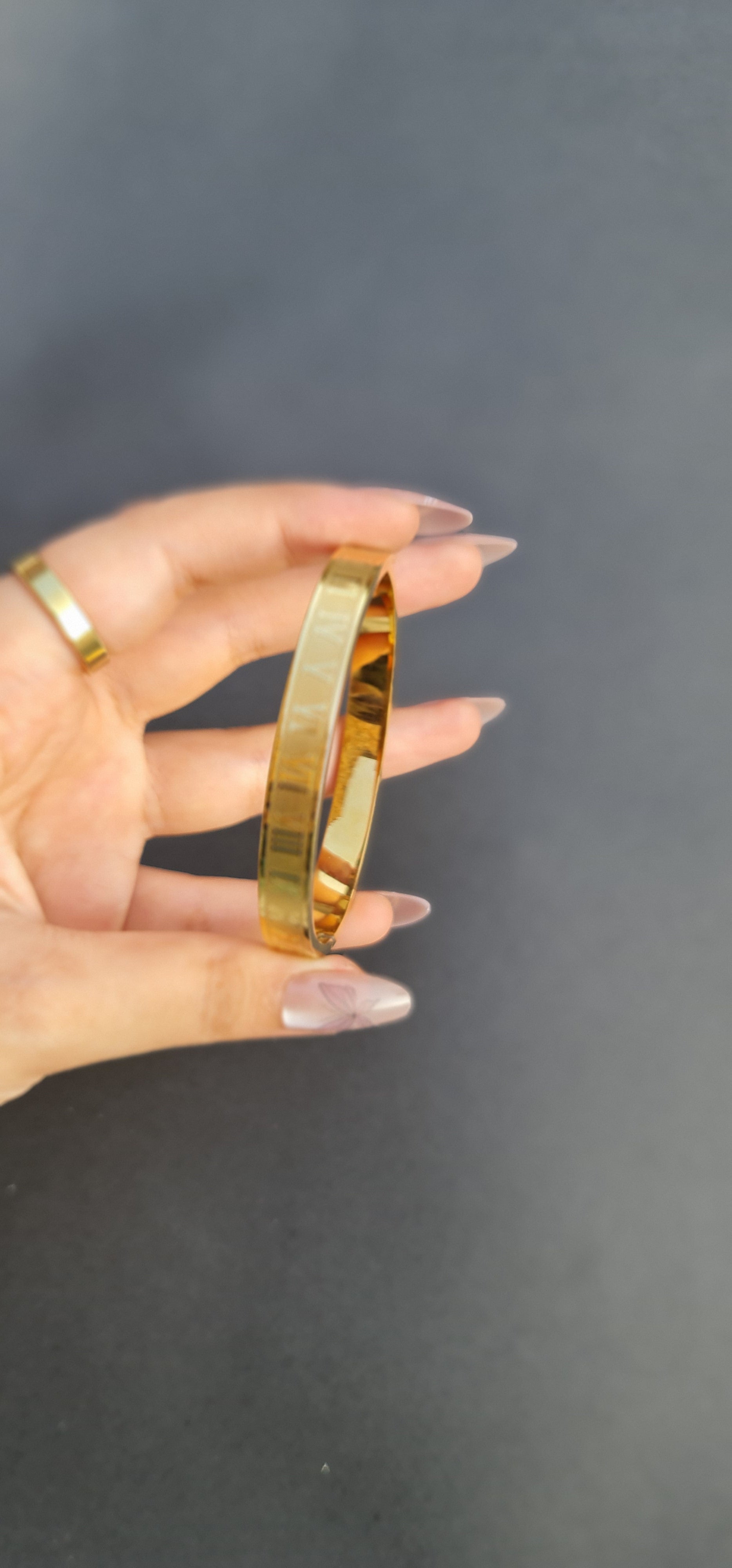 Gold-Toned Stainless Steel Bangle Bracelet with Roman Numerals
