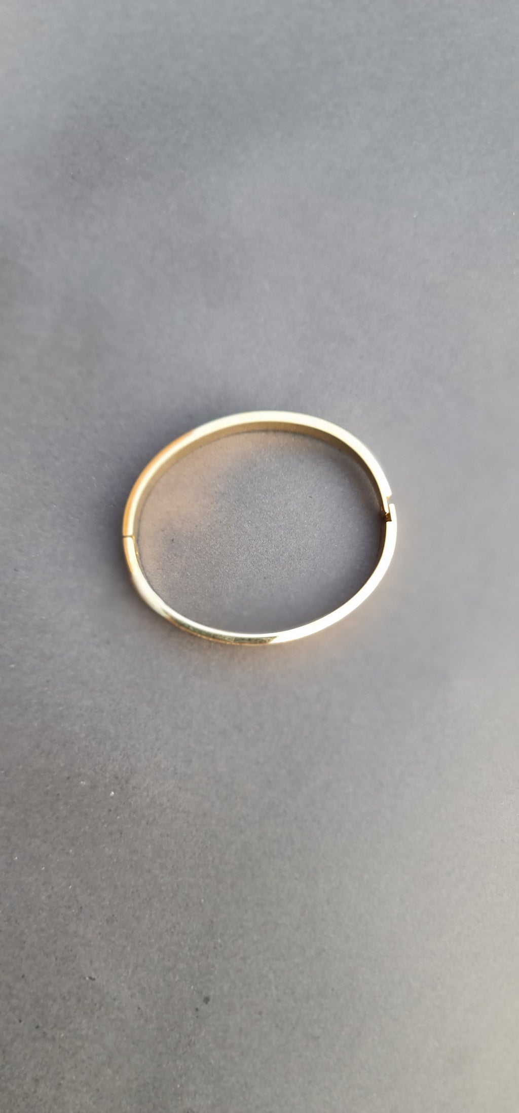 Gold-Toned Stainless Steel Bangle Bracelet with Roman Numerals