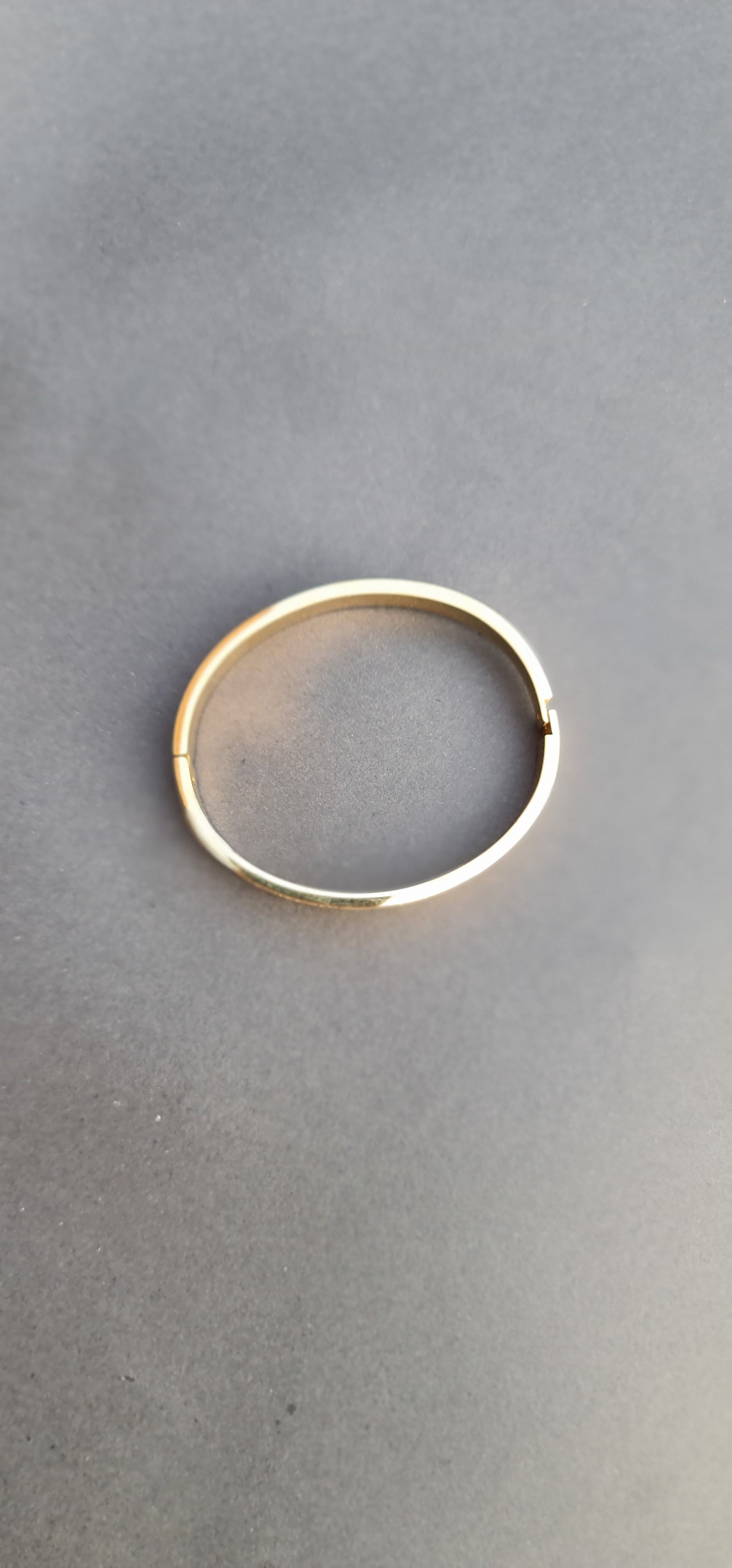 Gold-Toned Stainless Steel Bangle Bracelet with Roman Numerals