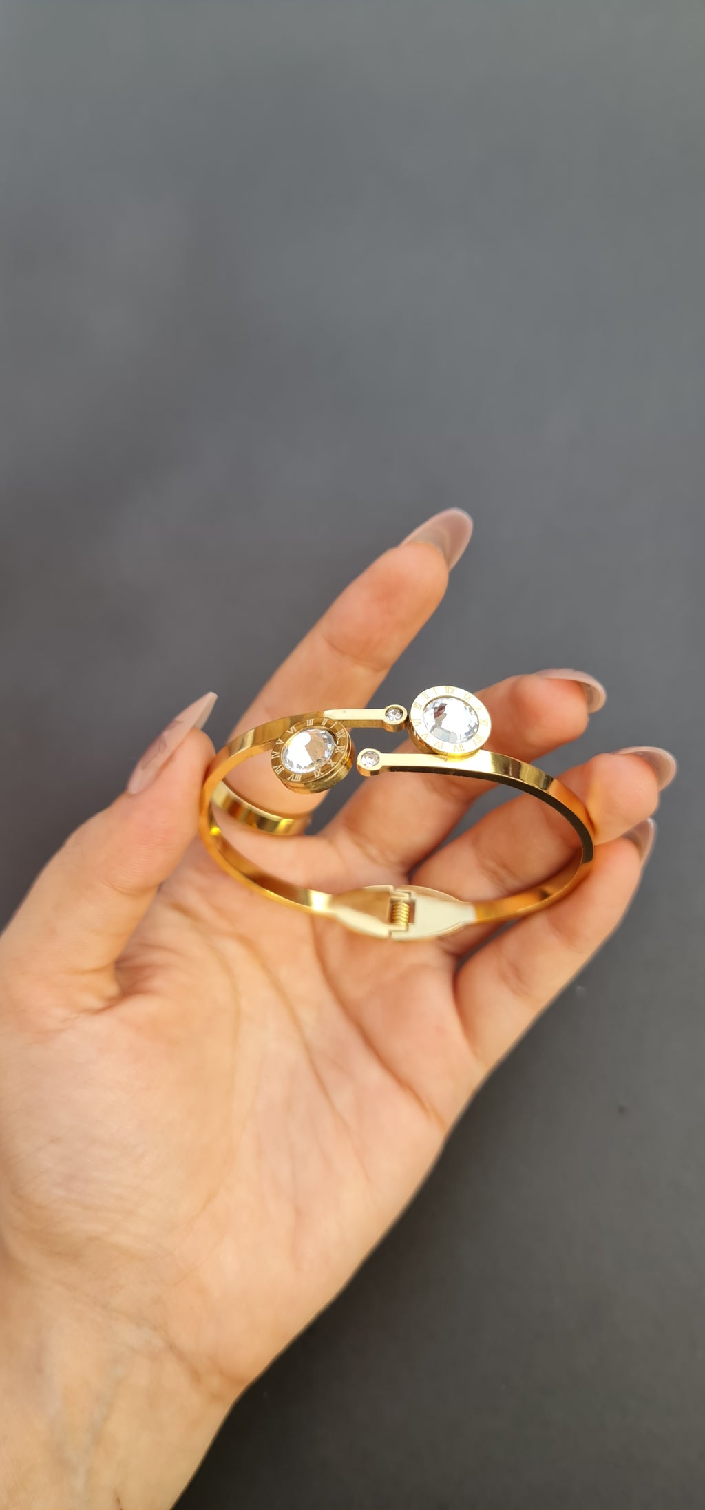Gold-Toned Stainless Steel Bangle with Roman Numerals and Crystals