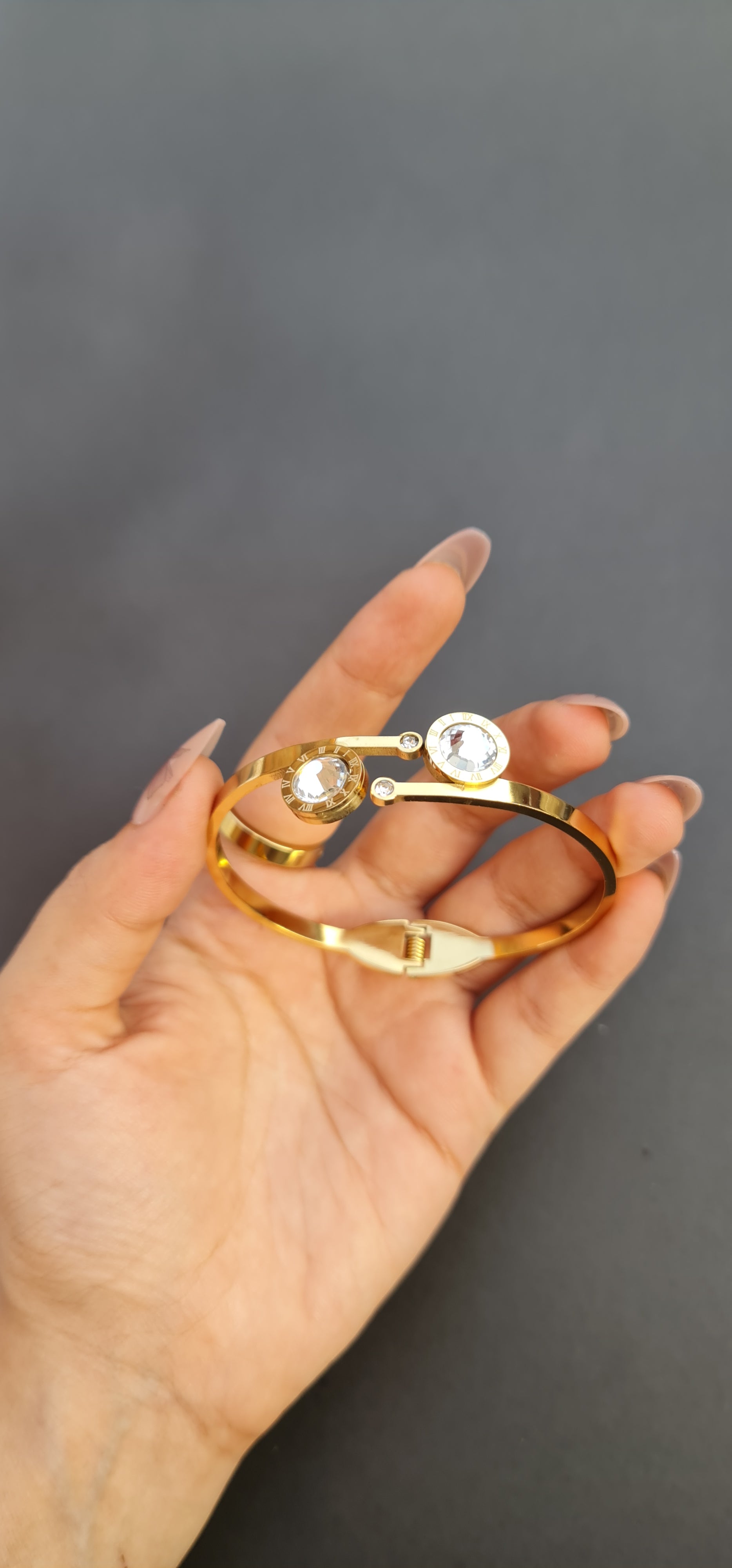Gold-Toned Stainless Steel Bangle with Roman Numerals and Crystals