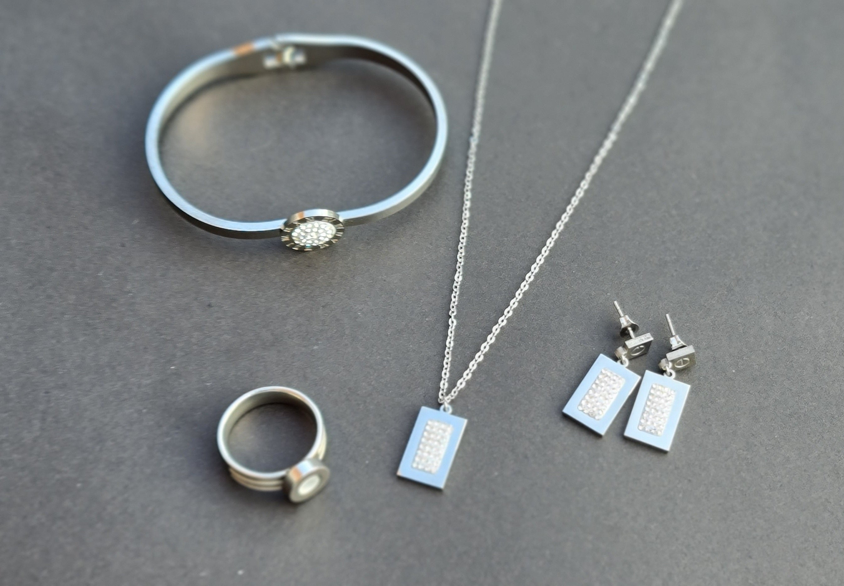 Stainless Steel Bracelet, Necklace, Ring, and Earring Set