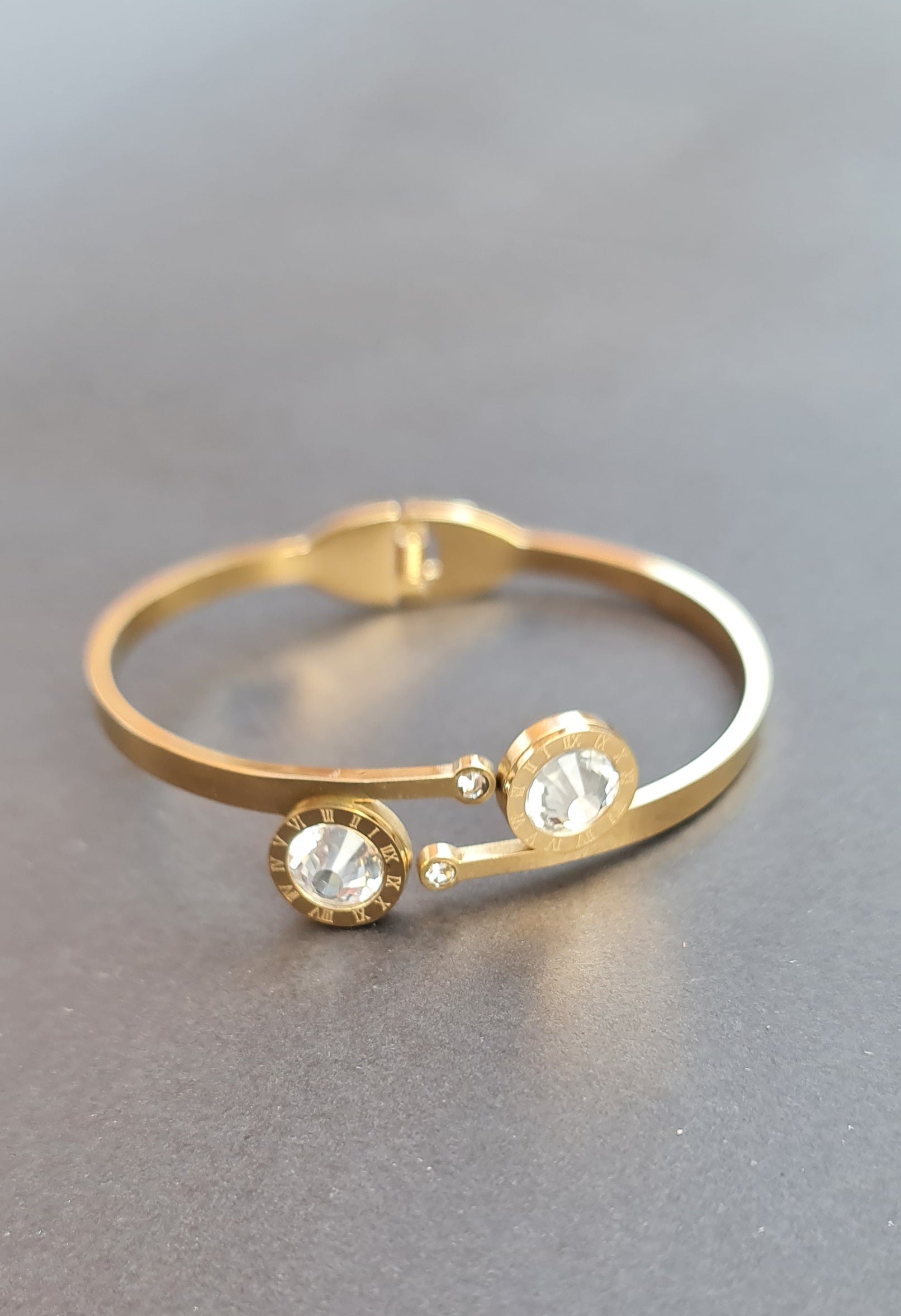 Gold-Toned Stainless Steel Bangle with Roman Numerals and Crystals