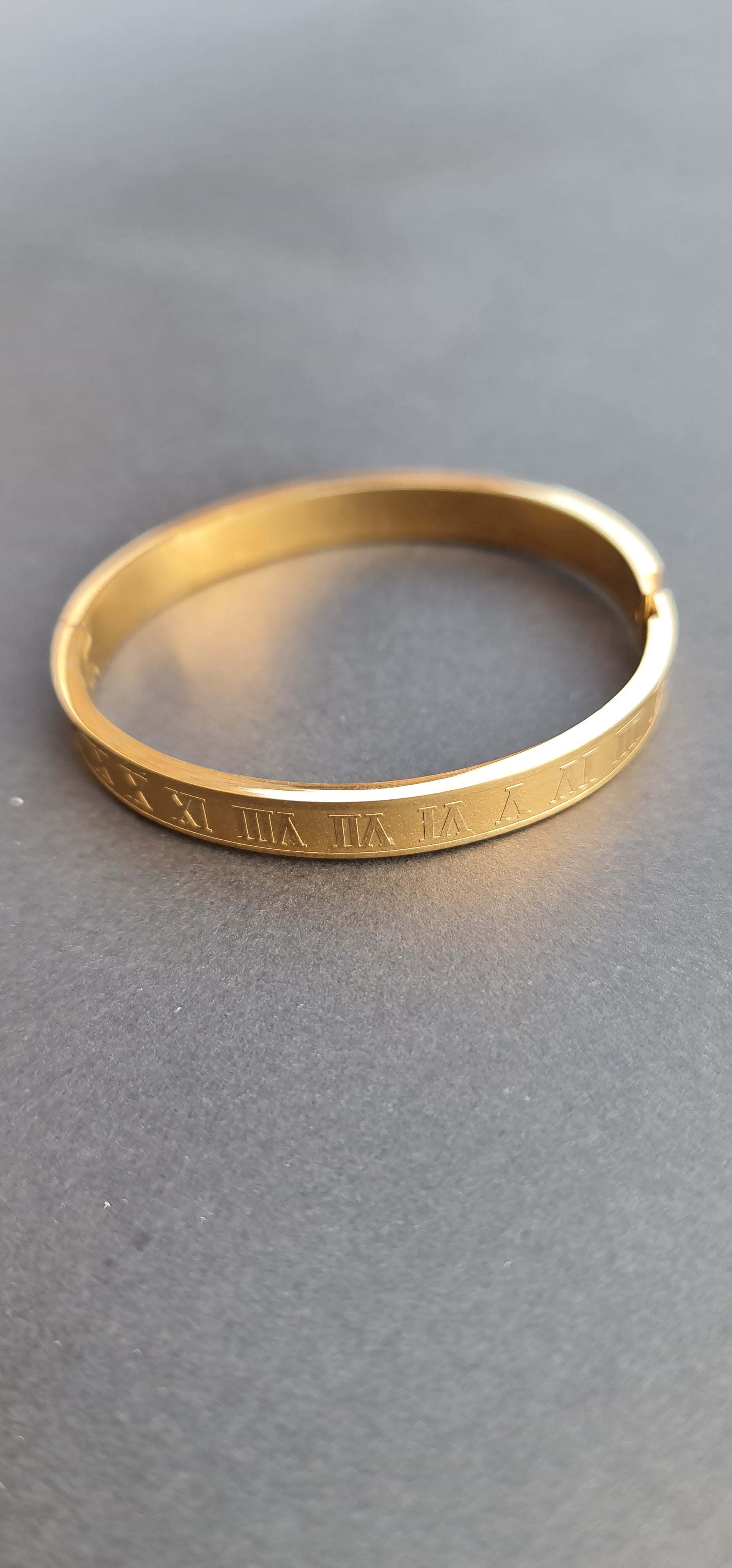 Gold-Toned Stainless Steel Bangle Bracelet with Roman Numerals